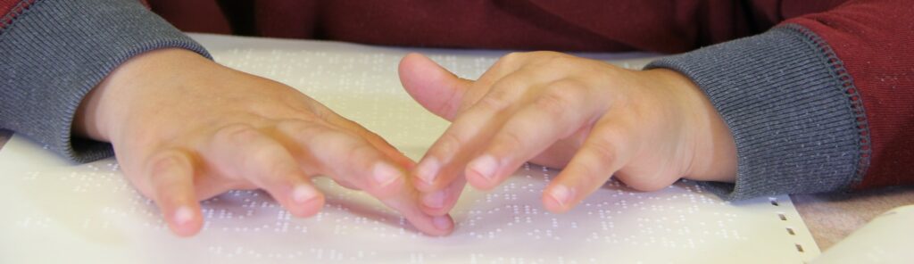 Hands Reading Braille